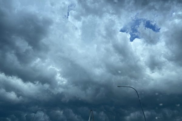 Dark storm clouds gathering overhead, illustrating the need for seeking wise counsel before moving forward.