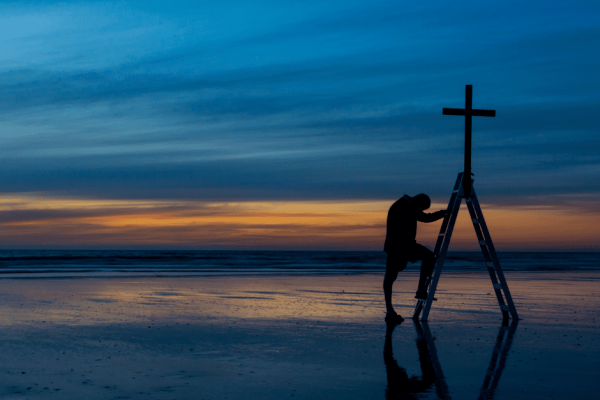 praying at cross beach